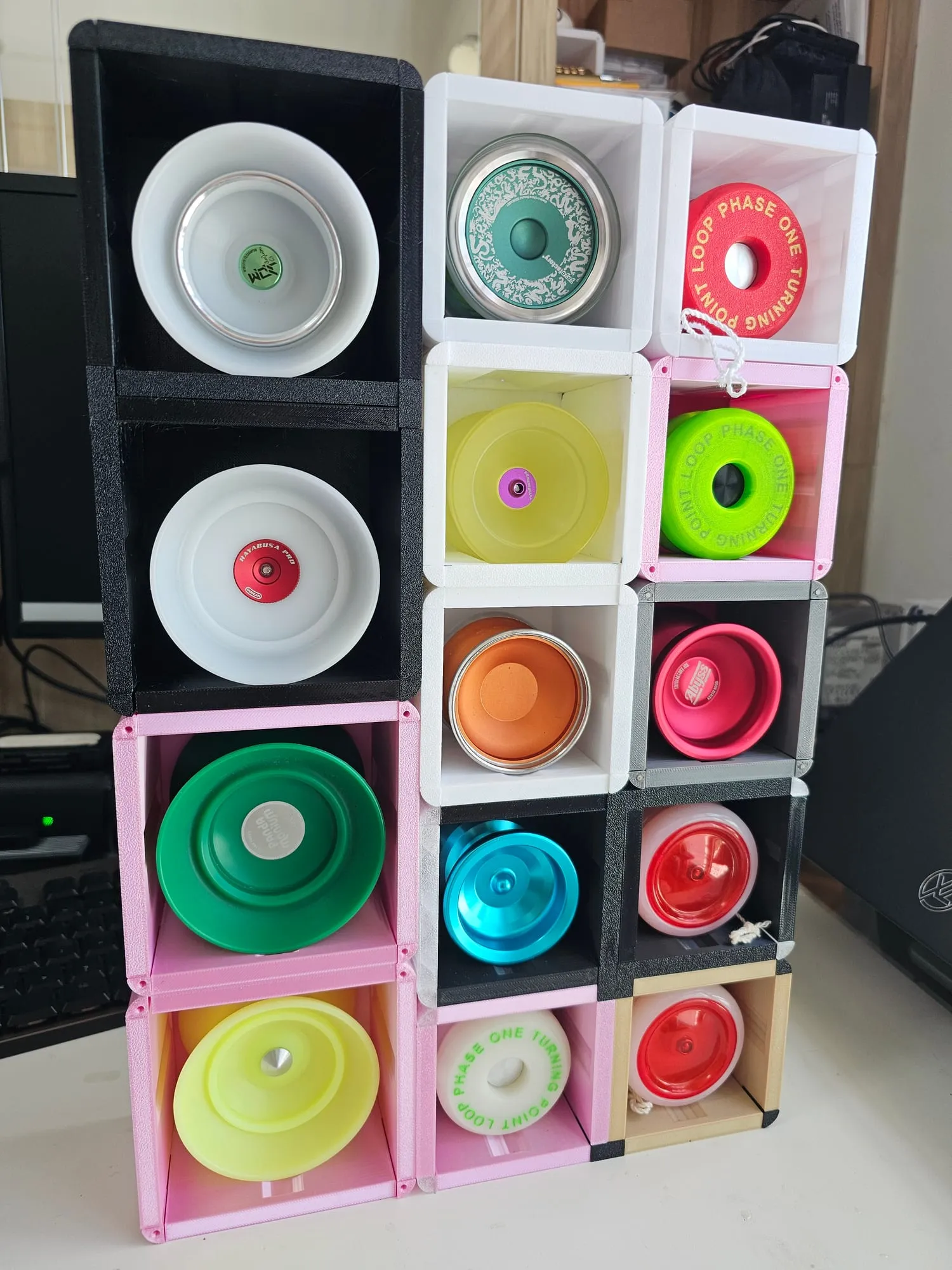 A ThrowGRID wall mixing oversized 4A cubes along the bottom row with standard 1A cubes above, all holding yo-yos
