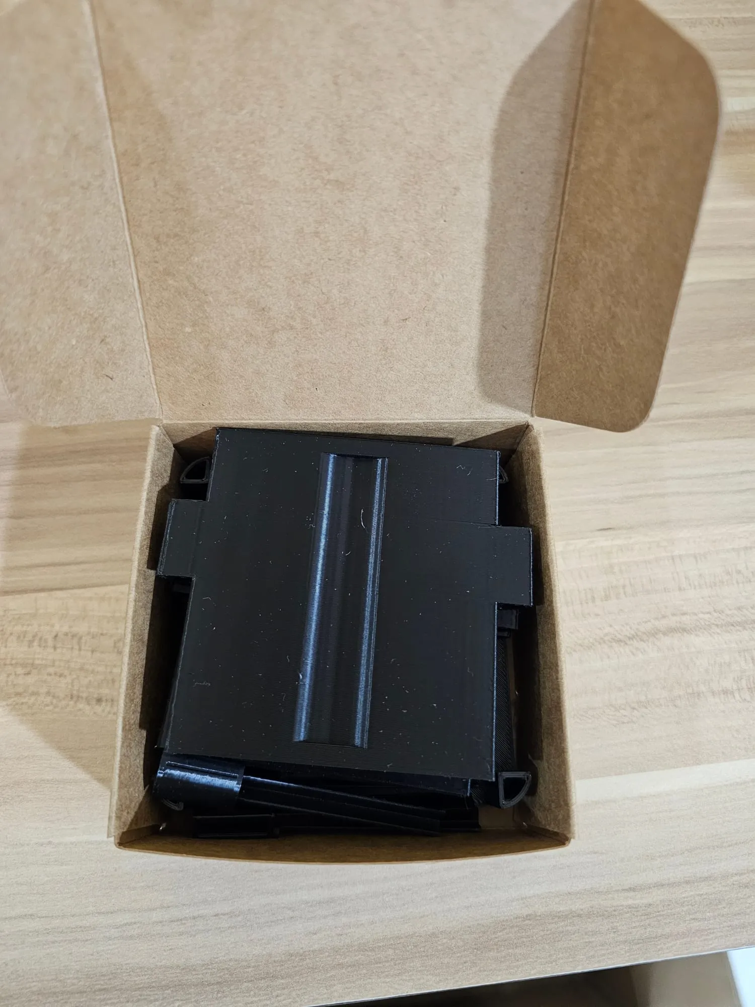ThrowGRID parts packed in a plain kraft card box